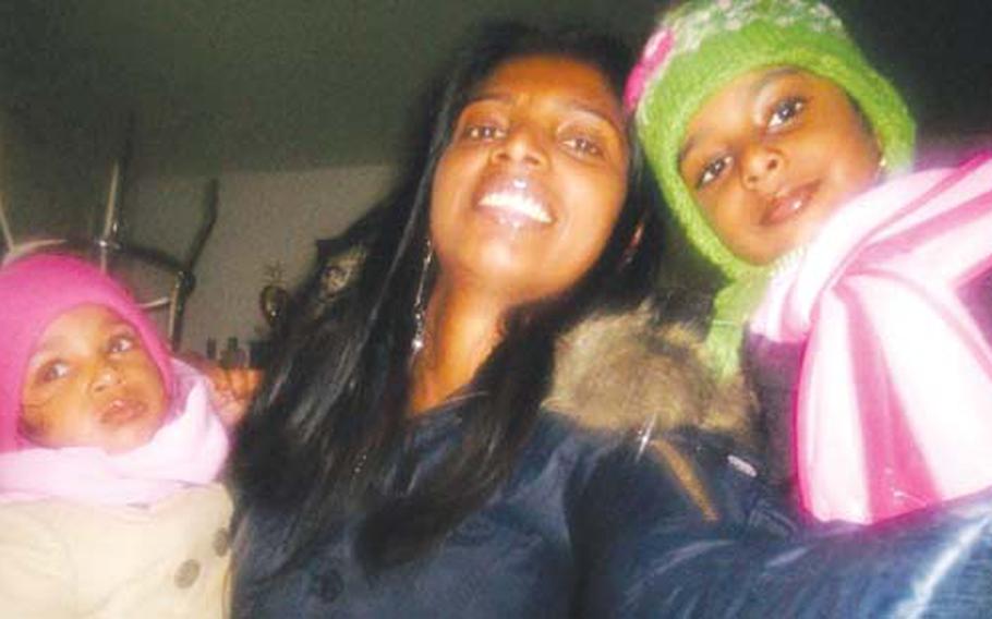 Narinesammy’s wife, Ratashwarie, center, poses with daughters Alisha, 1, and Tiffanie, 4, last winter.