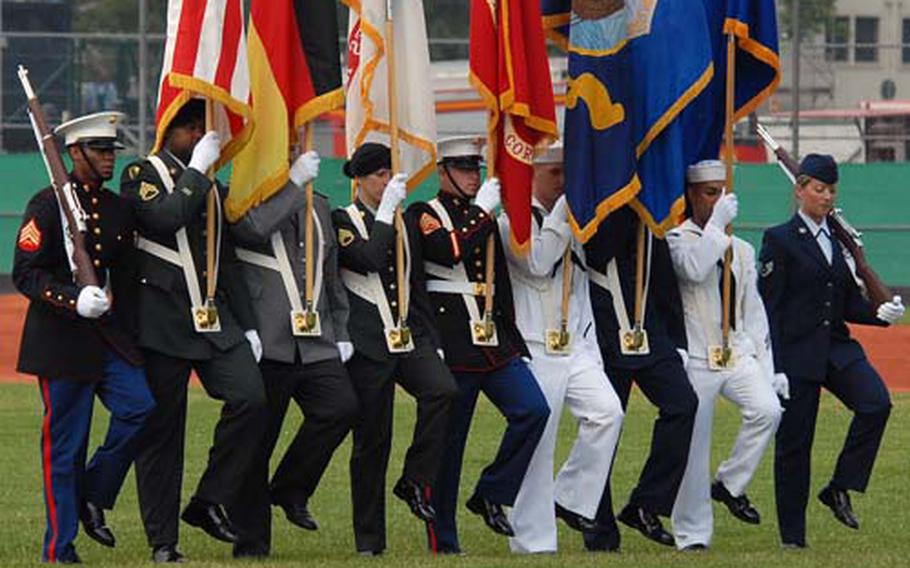 The U.S. European Command honor guard marches onto the field.