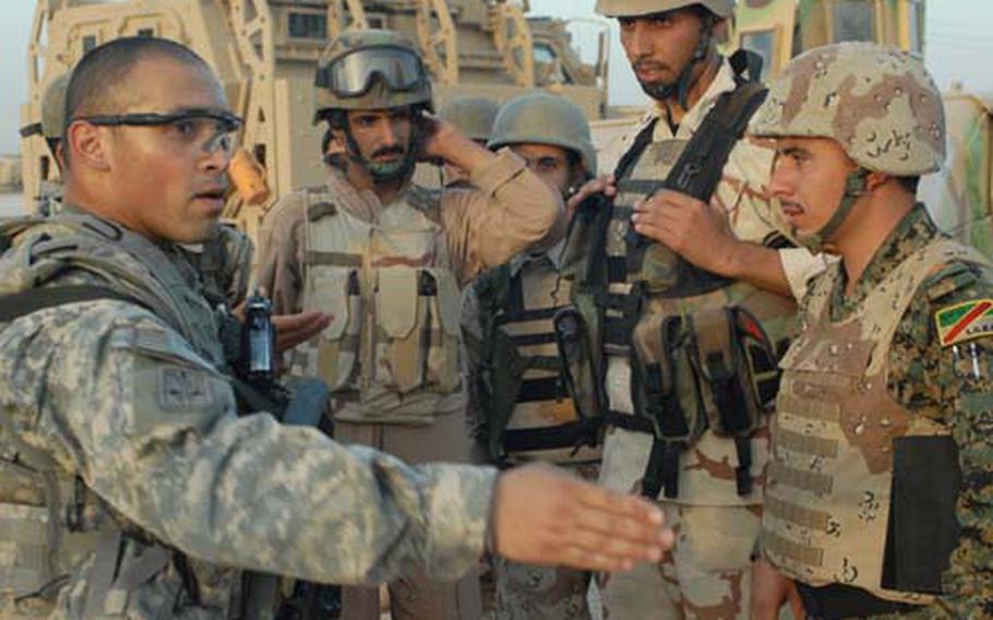 Staff Sgt. Juan Medina-Torres, 32, of Puerto Rico, and others from Task Force 1st Battalion, 2nd Infantry Regiment, shown on June 26, are training Iraqi security forces in the Najaf area, but the trust between the two groups is still growing slowly.