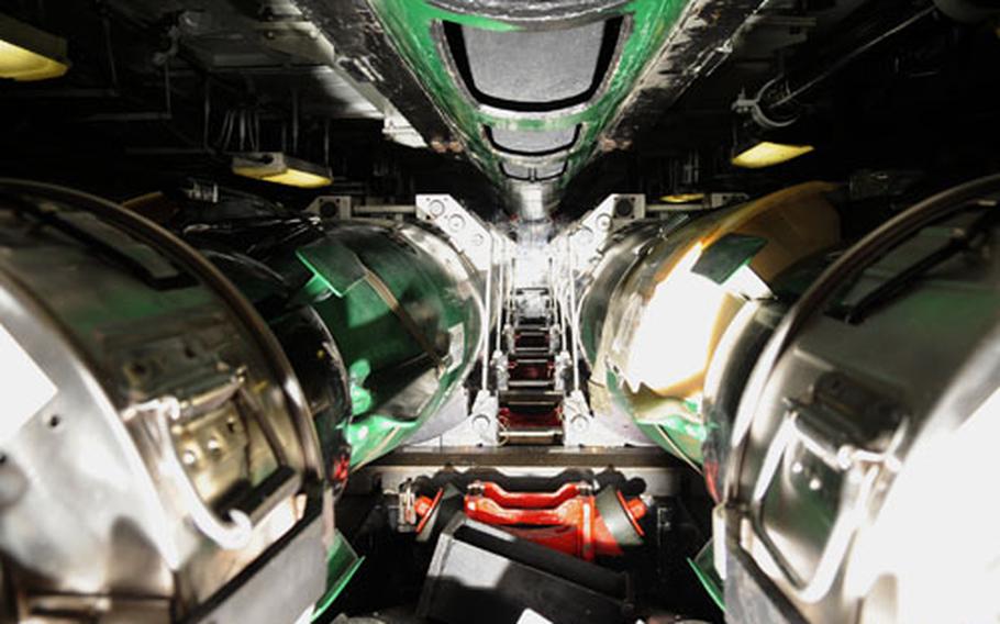 The USS Seawolf’s MK-48 torpedoes lie ready on the torpedo room during the submarine’s Western Pacific deployment in May.