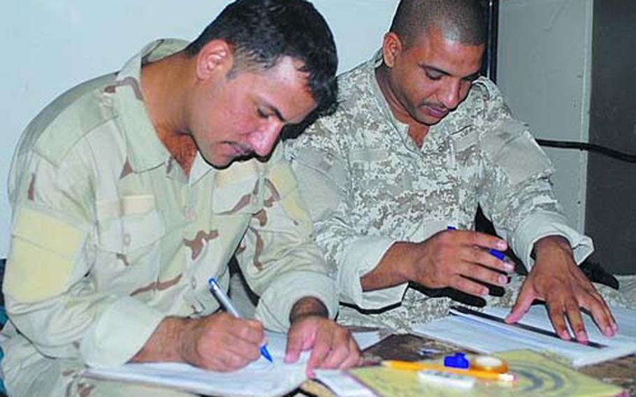 Iraqi soldiers prepare an equipment inventory in their barracks last week. Many Iraqi troops have access to Humvees, an Iraqi version of the MRAPs, Kevlar helmets and body armor.