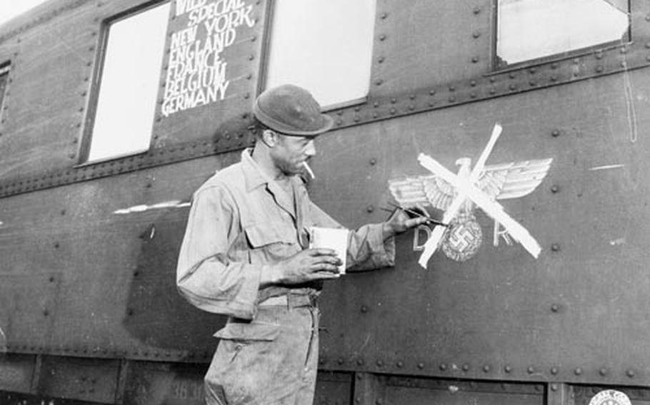 Army Pvt. 1st Class Eugene Davis of the 375th Engineer Battalion paints over a swastika on a train car in Pallenberg, Germany. The image is part of a gallery of photos for an ongoing research project by historians Maria Höhn and Martin Klimke documenting the stories of black servicemembers in postwar Germany and how those experiences helped shaped the civil rights movement in the U.S. and abroad. The researchers are looking for more black veterans who served in postwar Germany to share their stories.
