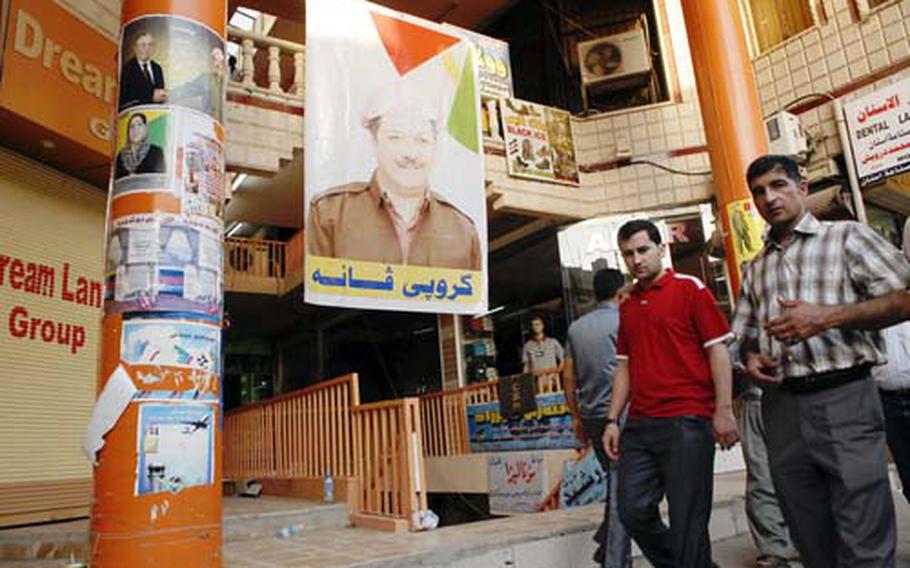 A poster of Massoud Barzani hangs at the main market in downtown Irbil, the capital of Iraq’s Kurdish region. Elections for the regional government are set for Saturday.