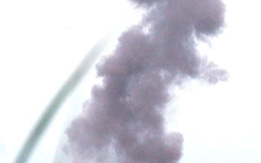 About 20 pounds of C-4 explosive send a cloud of black smoke into the air on Draughon Range.