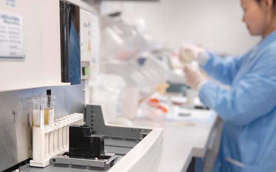 Urine samples from the Navy&#39;s drug prevention program are sent to several labs in the United States for analysis. Pictured is a machine used in the urine analysis process.
