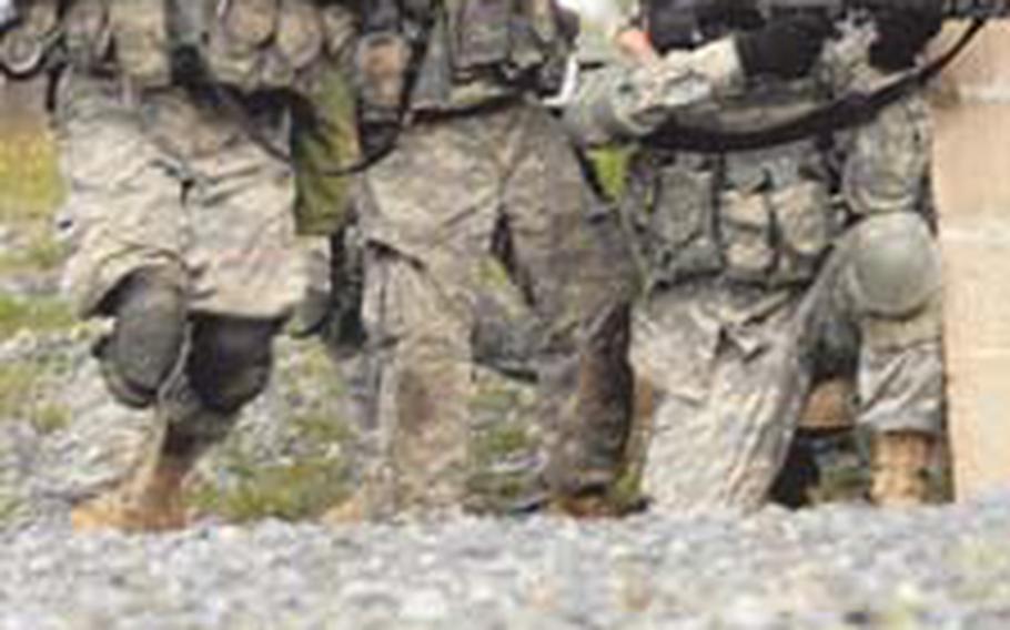 Sgt. 1st Class Aaron Beckman, left, takes the lead during competition. Beckman was named USAREUR’s NCO of the Year.