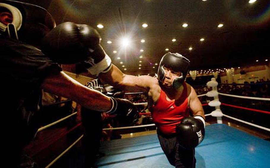 A Friday Night Fight Night contestant lands a right cross during a heavyweight bout Aug. 28.