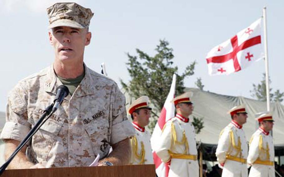 Col. Scott C. Cottrell, director, Marine Corps Training and Advisory Group, speaks to U.S. Marines and Georgian soldiers during the opening ceremony Monday of the Georgia Deployment Program at the Krtsanisi National Training Center.