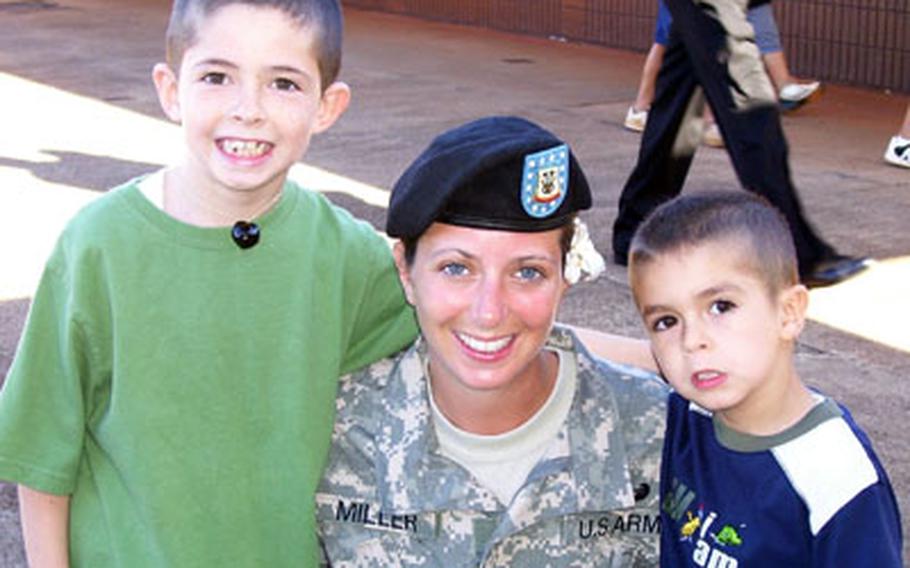 In this 2006 photo, Staff Sgt. Jessica Tolbe (shown with her former husband’s name on her uniform) poses with her sons Jordan (left) and Jackson. Tolbe, who is fighting for custody of the boys with her ex-husband, believes her overseas deployment to Iraq played a factor in her losing custody of the children.