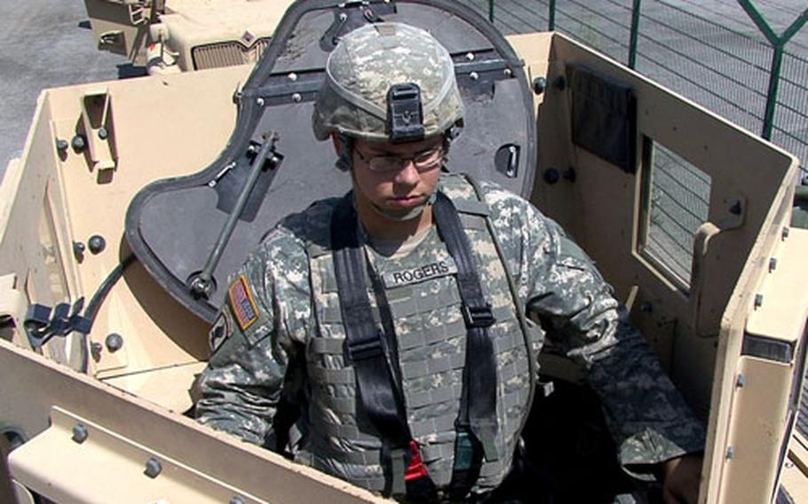 A soldier demonstrates the Gunner Restraint System in the gun turret of an MRAP vehicle. About 75 soldiers took part in the Army's first MRAP Operators Course in Europe July 28-31, in Hohenfels, Germany.