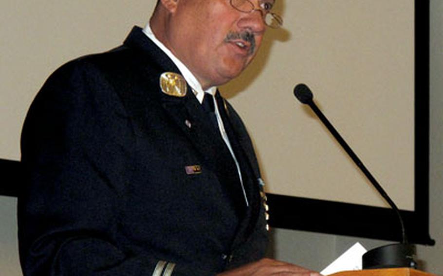 Retired New York City firefighter Al Fuentes, a survivor of the World Trade Center attacks, spoke to sailors at the Chapel of Hope on Friday.
