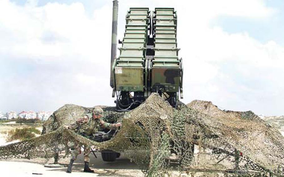 A soldier from V Corps’ Alpha Battery, 5th Battalion 7th Air Defense Artillery, positions a Patriot missile launcher in Tel Yona, Israel, as part of field training supporting exercise Juniper Cobra 05. The bi-annual exercise, to be held next month, comes at a time of heightened tensions between Israel and Iran.