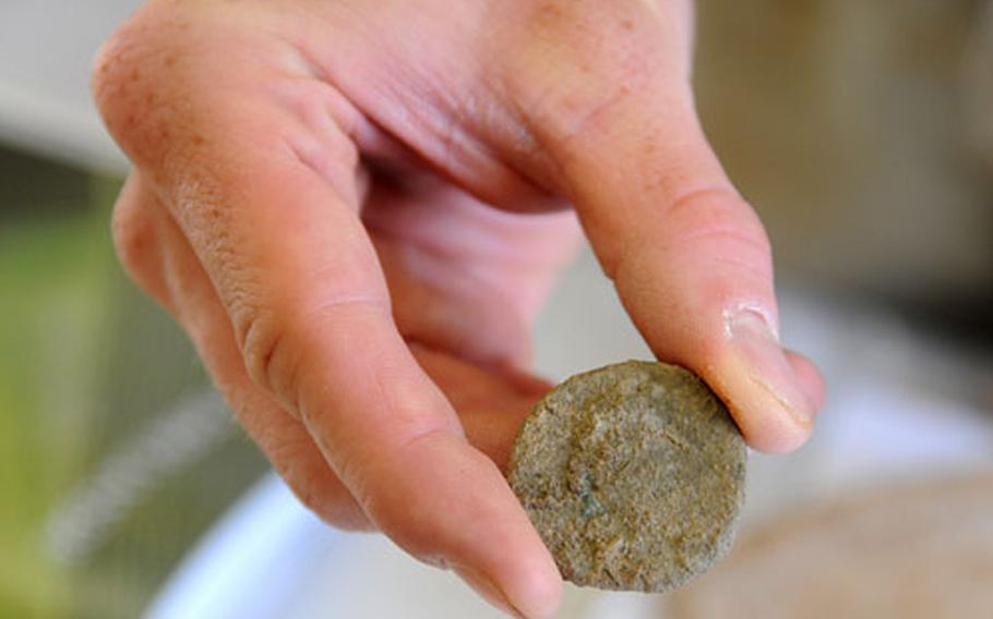 This Roman coin, made of either copper or bronze, was found at an excavation site where a road is being built for the new housing area at Wiesbaden Army Airfield.