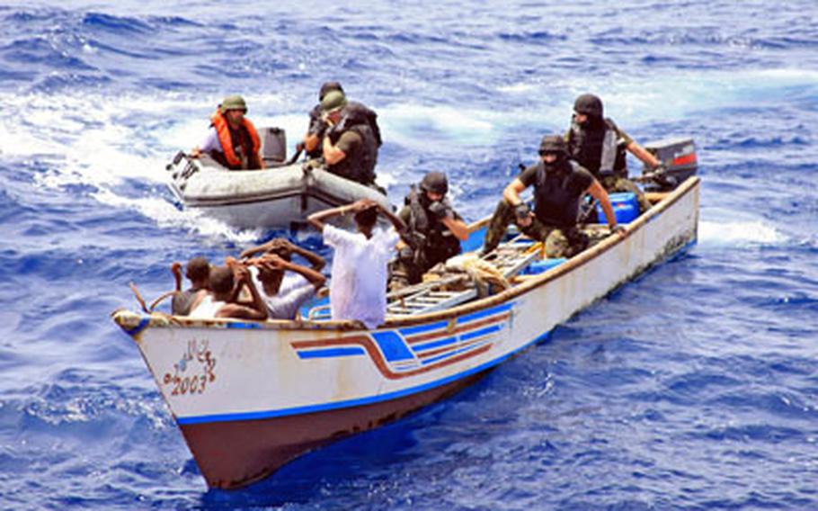 NATO forces detain suspected pirates in the Gulf of Aden area. Piracy attacks in the area are down this September compared to the same time last year. NATO and other military officials attribute the decline of successful attacks to a beefed-up military presence and merchant ships becoming better at protecting themselves.