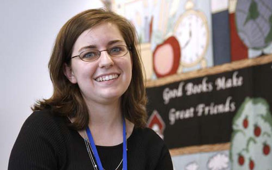 Stephanie Holmes in the library at the Theresa Primary School in Theresa, N.Y., where she works as a substitute teacher.