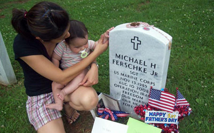 Hotaru Ferschke and son Mikey visit the grave of his father Michael Ferschke Jr., who was killed in Iraq before his son was born. She is fighting an immigration law that denied her residency in the U.S. because she was married by proxy after she became pregnant and her husband never returned home to consumate the marriage.