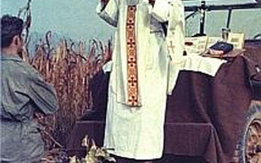 In this undated photo, Father Emil Kapaun, a Catholic priest and Army chaplain, celebrates Mass in the field during the Korean War. Kapaun, already under consideration for sainthood, has won the endorsement of former Army Secretary Pete Geren to receive the Medal of Honor.