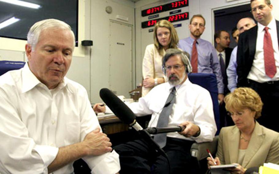 Secretary of Defense Robert Gates speaks to reporterstraveling with him aboard the E4-B "Doomsday" plane enroute from Honolulu to Tokyo on Monday.