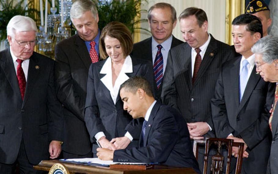 President Barack Obama on Thursday signed into law a measure to provide advance funding for the Department of Veterans Affairs medical programs, in an effort to avoid funding gaps caused by near-annual budget delays in Congress. At the White House ceremony were (from left to right): Rep. Henry Brown Jr., R-S.C.; Rep. Mike Michaud, D-Maine; House Speaker Nancy Pelosi; Rep. Chet Edwards, D-Texas; Rep. Bob Filner, D-Calif.; VA Secretary Eric Shinseki; Sen. Daniel Akaka, D-Hawaii.