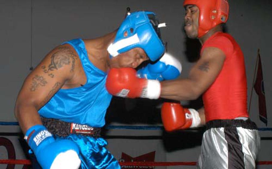 Two servicemembers fight during an August 2007 boxing match at Kunsan Air Base, South Korea.