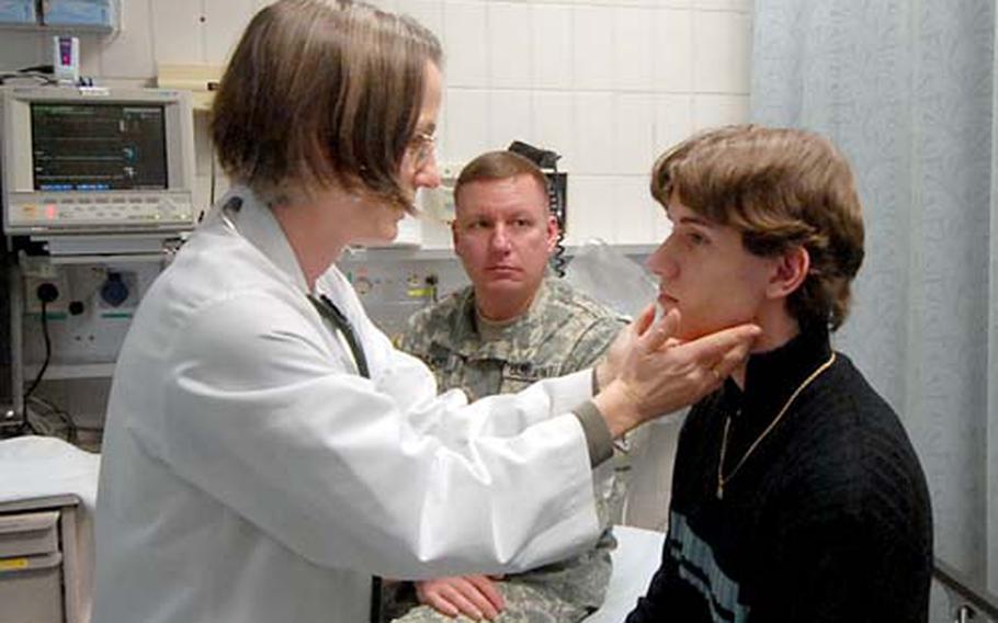 Dr. Gabriele Vinar, left, examines Neil Baker at the Heidelberg Hospital's Acute Care Clinic in this January 2008 photo. For years, civilian patients found it difficult to get medical appointments at military clinics in Europe, but Europe Regional Medical Command officials have taken steps to improve access to doctors.