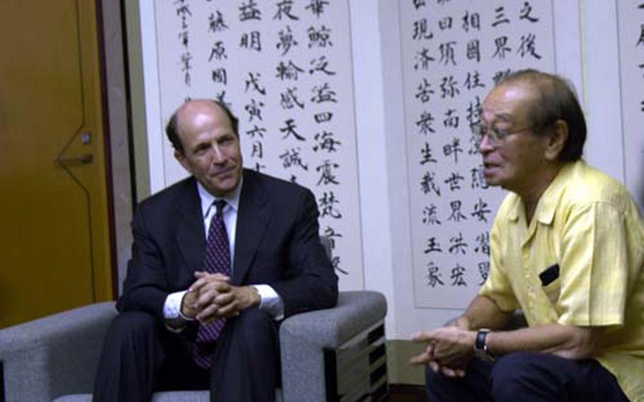 U.S. Ambassador John Roos visits Monday with Okinawa Gov. Hirokazu Nakaima at the governor’s office in Naha on the first day of his three-day tour to Okinawa. It was Roos' first trip to Japan's southernmost island, home to about 60 percent of U.S. Forces Japan troops, since becoming ambassador.