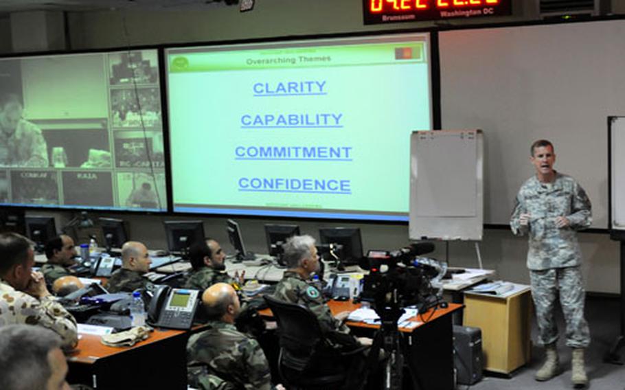 Gen. Stanley McChrystal, commander of the International Security Assistance Force, addresses members of his staff Tuesday, moments after President Barack Obama announced he would send 30,000 more U.S. troops to Afghanistan.