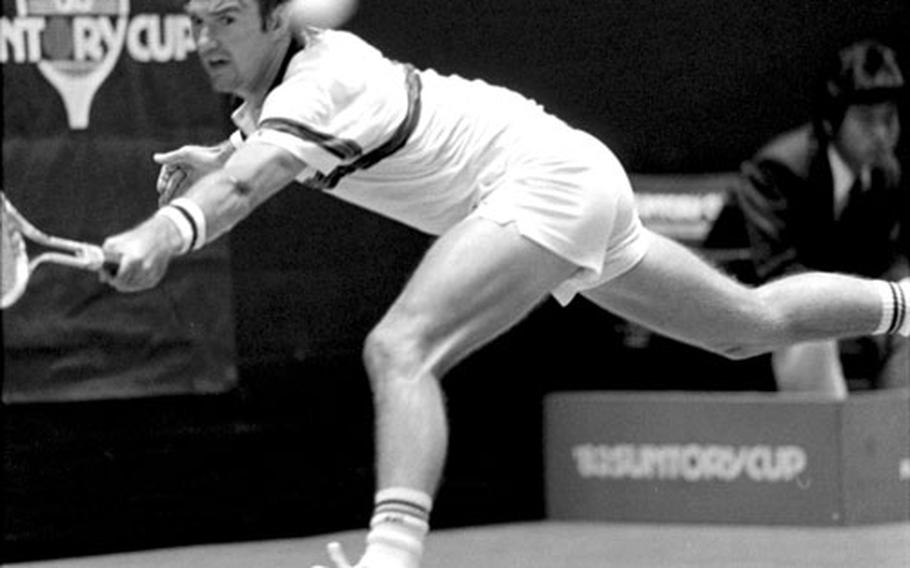 Jimmy Connors lunges for the ball during his match against Bjorn Borg in the 1983 Suntor Cup tennis tournament at Tokyo.