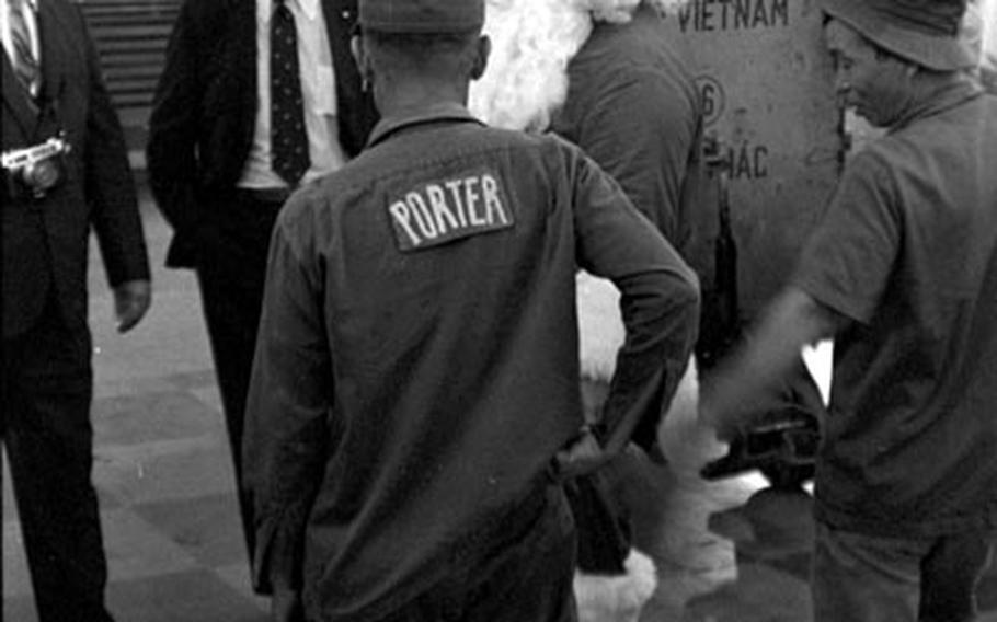 Santa Claus, a.k.a. Jim Straughan, waits for permission to enter South Vietnam after arriving at Tan Son Nhut Air Base in December, 1970.