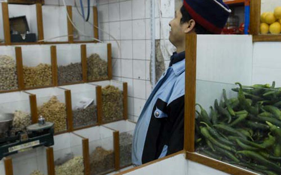 Foreign contractors are the life blood of most businesses in Baghdad's Green Zone. This shop adopted a bin system for displaying produce on the advice of a British contractor. But with foreign firms packing up, shops in the heavily fortified district have seen their business decline sharply.