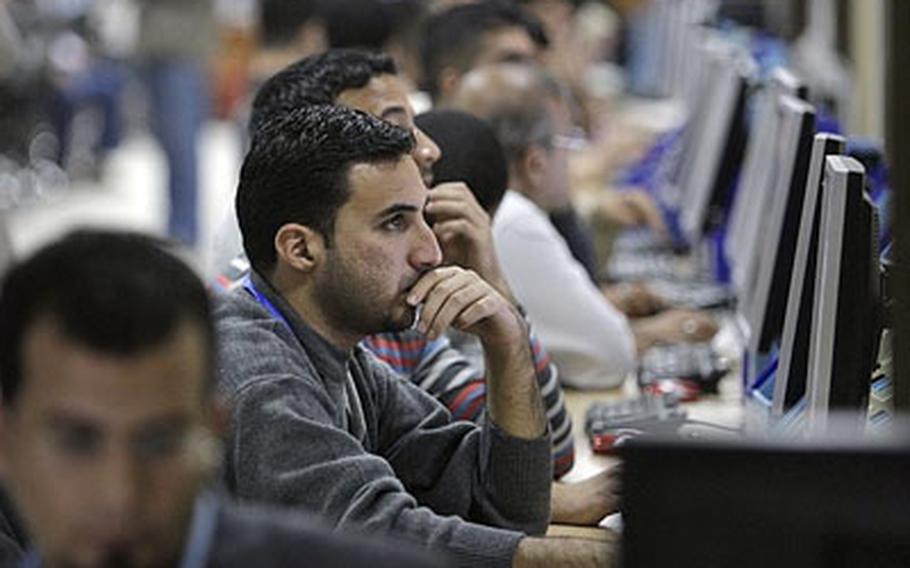 Counting and data input workers at the Independent High Electoral Commission (IHEC) prepare for Sunday's parliamentary elections, at the IHEC headquarters in Baghdad, Iraq, Saturday, March 6.
