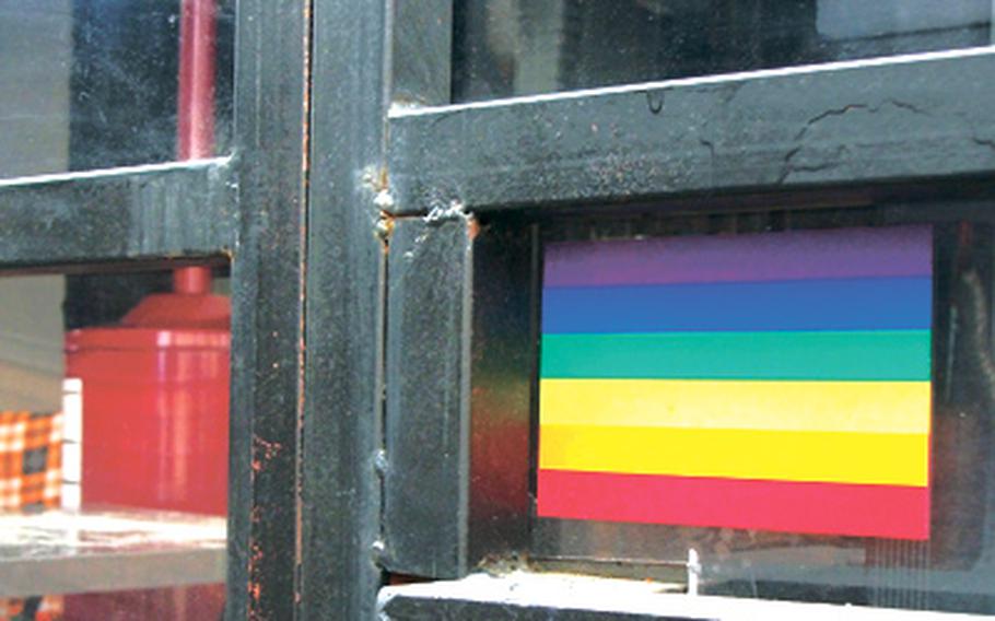 A rainbow sticker hangs in the window of a lounge in Seoul's gay-friendly Homo Hill district, which attracts both gay and straight customers, including U.S. troops.