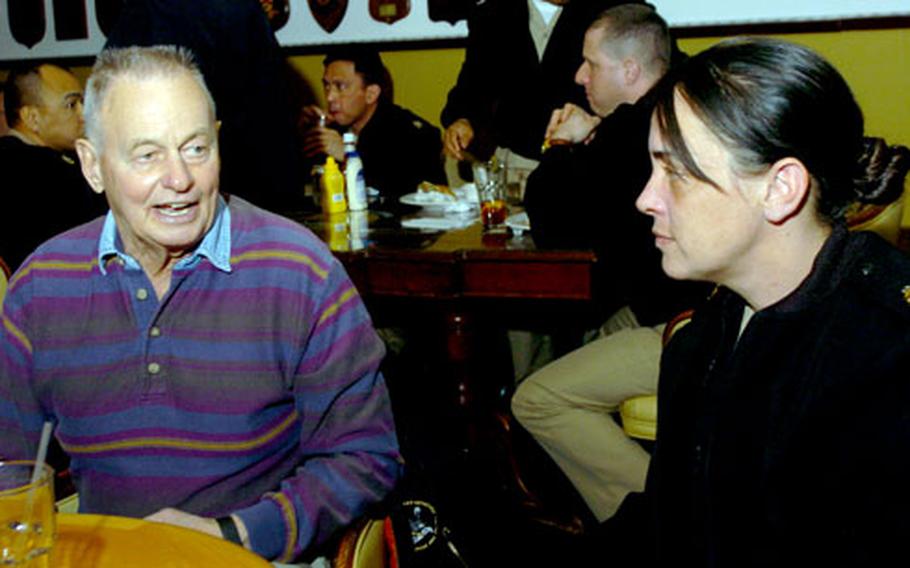 Rudy Boesch, retired Navy SEAL and contestant from the first season of television&#39;s "Survivor," talks with sailors at Chief Petty Officer&#39;s club at Yokosuka Naval Base on Tuesday. Boesch&#39;s Navy career spanned 45 years, from the end of World War II to the beginning of Desert Storm.