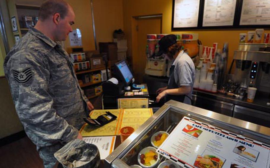 Tech. Sgt. Daniel Beasely orders a drink at the Mokuteki Cafe Friday at Misawa Air Base, Japan. He said a new initiative to offer and better promote healthful eating options on the base would be welcomed since they will “promote a healthier lifestyle.”