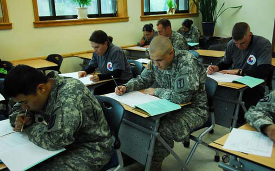 Members of HHC 65th Medical Brigade take their driver’s license tests at U.S. Army Garrison-Yongsan, South Korea, on Thursday. Rules for maintaining licenses vary by command and can be complex.