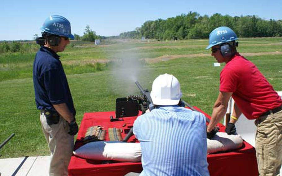 Stars and Stripes reporter Jeff Schogol mows down targets with the .50-caliber M2A1 "Ma Deuce" machine gun, which is fitted with a quick-change barrel that will allow for easier operation of the weapon, on Wednesday at Aberdeen Proving Grounds, Md.