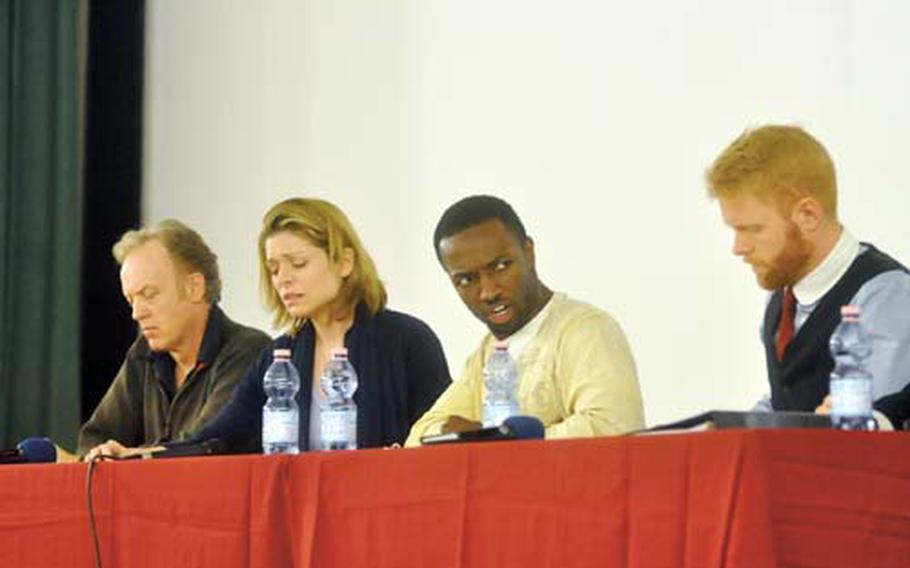 From left, actors Reed Birney, Gretchen Egolf, Jamie Hector and Brendan Griffin perform readings of “Ajax” and “Philoctetes” as part of the Theater of War project, which is staging readings at 10 garrisons throughout Germany this month.