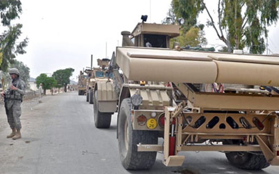 The Husky vehicle, with its ground-penetrating radar, patrols the village of Yaqubi in the Sabari district of Khost province along the bomb-riddled Route Alaska on April 7.