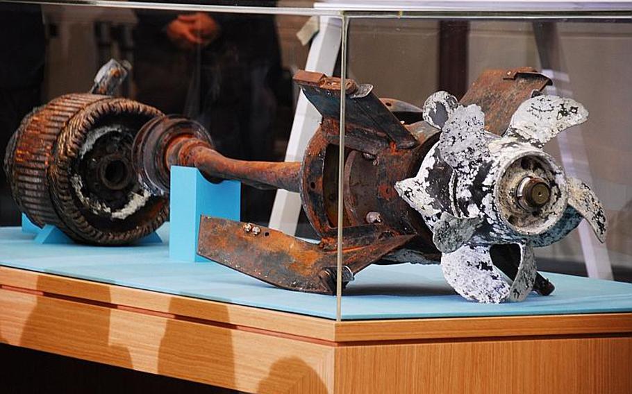 220510WARSHIPWEBphoto01
Ashley Rowland/Stars and Stripes
May 20, 2010
Investigators say this is the propeller and motor of the torpedo that investigators say caused the sinking of a South Korean ship on March 26, killing 46 troops. The investigation team exhibited the parts Thursday during a press conference at the Ministry of National Defense when it announced its findings in the sinking of the Cheonan. The team concluded that a North Korean submarine shot the torpedo, which caused a shock wave bubble that ripped the ship in half.