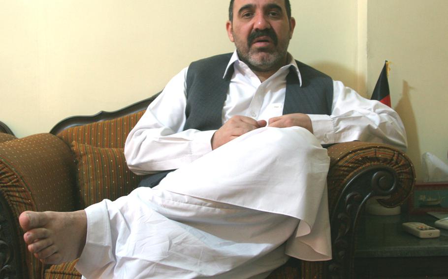 Ahmad Wali Karzai, the half-brother of Afghan President Hamid Karzai and one of the most powerful men in Kandahar, takes a break from meeting Afghan leaders at his home on May 10.