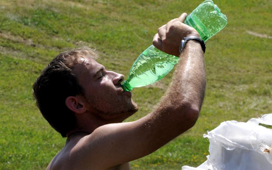 Henrique Barbosa, who has been working on the roads of Robinson Barracks in Stuttgart, Germany, said Friday he doubled the amount of water he drinks to avoid dehydration during the hot weather. Temperatures are expected to be in the 90s for many U.S. military communities in Europe this weekend.