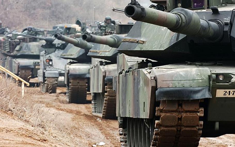 M1A1 Abrams tanks from 1-72nd Armor Regiment line up in preparation to assault a town during Warrior Focus, a training exercise at the Combined Arms Collective Training Facility at Rodriguez Live Fire Complex, South Korea. The Army has directed its commanders to start training its soldiers on hybrid threats, which means soldiers will now prepare not only for counterinsurgencies, but for conventional wars as well.
