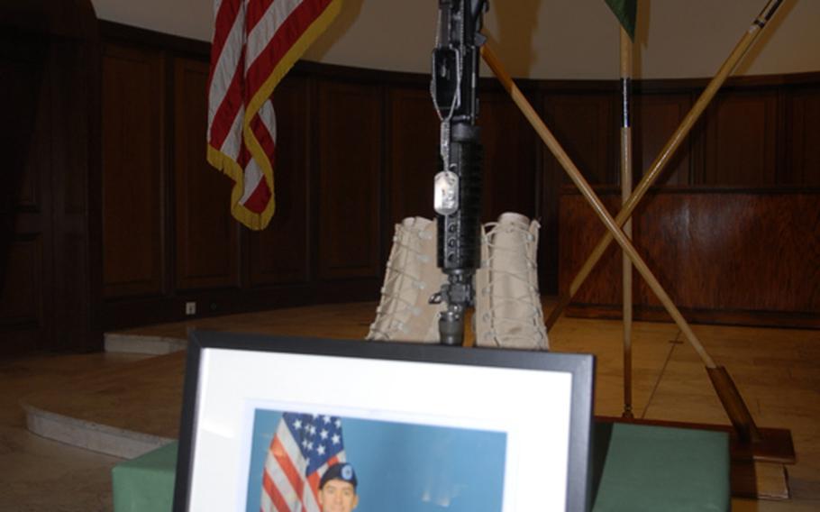 A photo of Staff Sgt. James R. Ide V and his bomb-sniffing dog, Ddaphine, was on display at Ide's military memorial service Thurday at the Vogelweh chapel in Kaiserslautern. Ide was killed Aug. 29 in Afghanistan when his unit was attacked by small-arms fire.