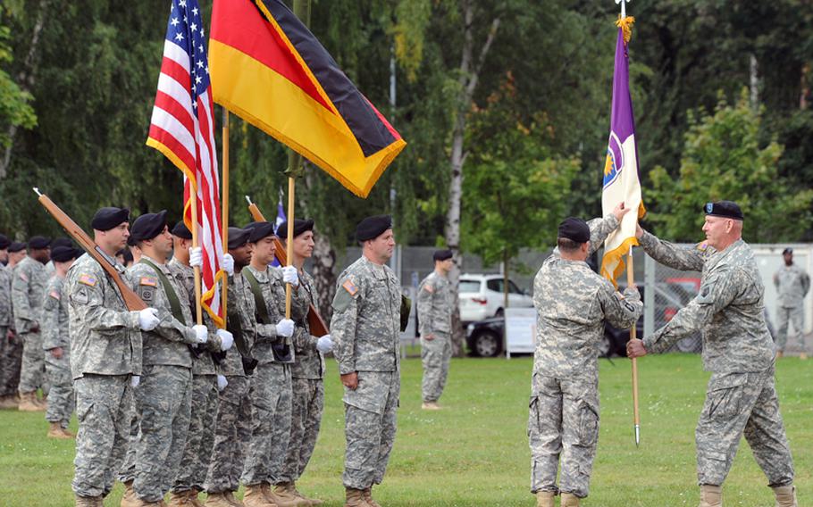 Brig. Gen. Jimmie Jaye Wells, right, commander of the 7th Civil Support Command, hands the colors of the 361st Civil Affairs Brigade to its commander, Col. Friedbert Humphrey, at a ceremony on Daenner Kaserne in Kaiserslautern, Germany, on Sept. 17. The brigade is mostly made up of reservists and is the only civil affairs brigade permanently stationed outside of the United States.