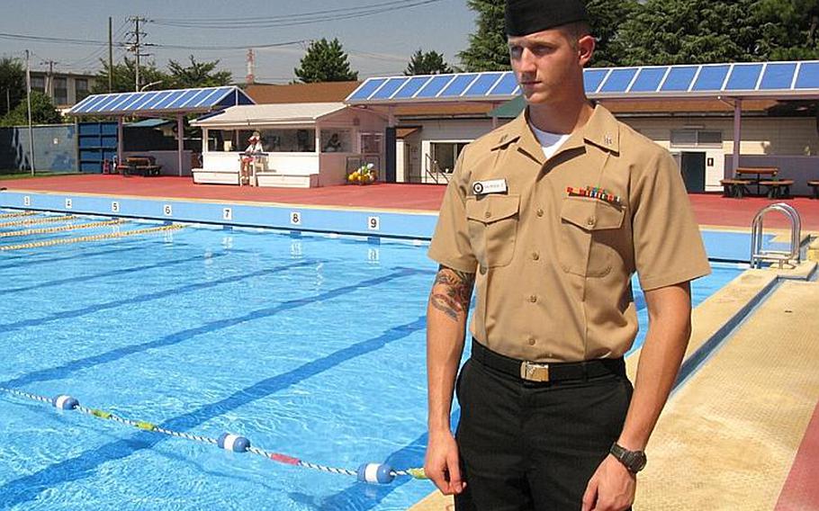 Seaman Colin Colfescu, a Navy corpsman, returns to the Naval air Facility Atsugi pool where he aided a 7-year-old Japanese boy who was floating unconscious in the pool Aug. 29. Colfescu, who had been off-duty and swimming at the time along with other corpsman, helped resuscitate the child. The child survived after spending time in a Japanese hospital. Colfescu was recognized with the Navy and Marine Corps Achievement Medal for his efforts.
