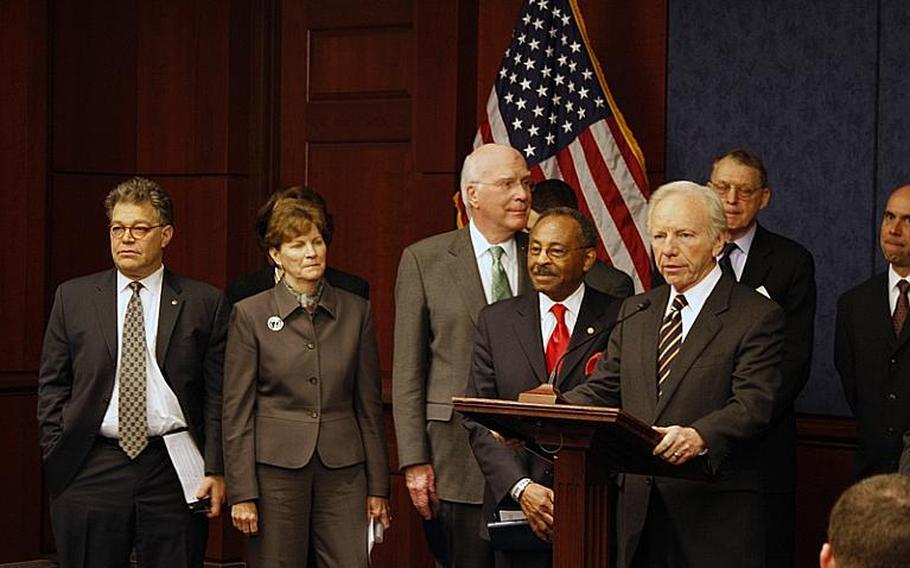 Surrounded by senators and gay rights advocates, Sen. Joe Lieberman, I-Conn., speaks to reporters at a Capitol Hill event Thursday about the chances of repeal the military's "don't ask, don't tell" law this year.