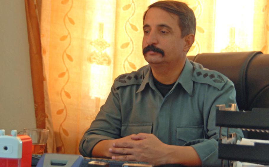 Col. Shir Shah, the Dand district chief of police, in his office during a meeting with a coalition soldier about ways to improve his police force. Shir Shah is struggling to maintain authority after a deal brokered by coalition forces integrated the militias of two powerful strongmen into his force.