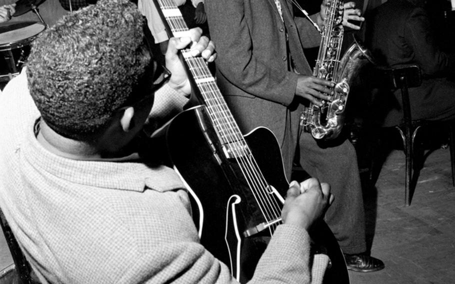 Guitarist George Yates and saxophonist Percy Owens of the 3rd Armored Division's Mellow Tones perform at the dance.