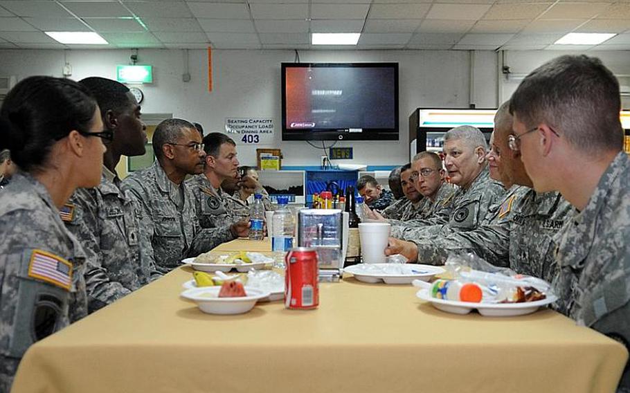Gen. Carter Ham, fourth from right, commander of U.S. Africa Command, has breakfast with servicemembers assigned to the Combined Joint Task Force-Horn of Africa at Camp Lemonier, Djibouti, on Sunday. Ham visited CJTF-HOA personnel three days after assuming command of AFRICOM on March 9 in Stuttgart, Germany. During his stopover, Ham met CJTF-HOA leaders, the Djiboutian chief of defense and the U.S. Ambassador to Djibouti.
R. J. Biermann/Courtesy U.S. Air Force