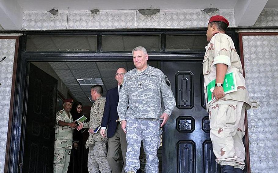 Army Gen. Carter F. Ham, commander of U.S. Africa Command, leaves Djiboutian military headquarters after a meeting with the country's chief of defense. Behind Ham is U.S. Ambassador to Djibouti James C. Swan, who also attended the meeting.
Seth Robbins/Stars and Stripes